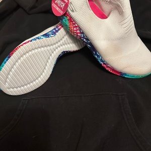 Slip on tennis shoe with a tie dye sole. Never worn